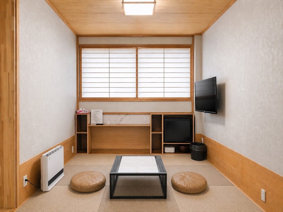 Luxury Twin Room, Slope side | Living area | TV, heated floors