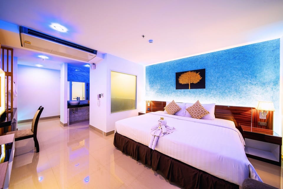 Deluxe Double Room, City View | In-room safe, desk, laptop workspace, blackout drapes