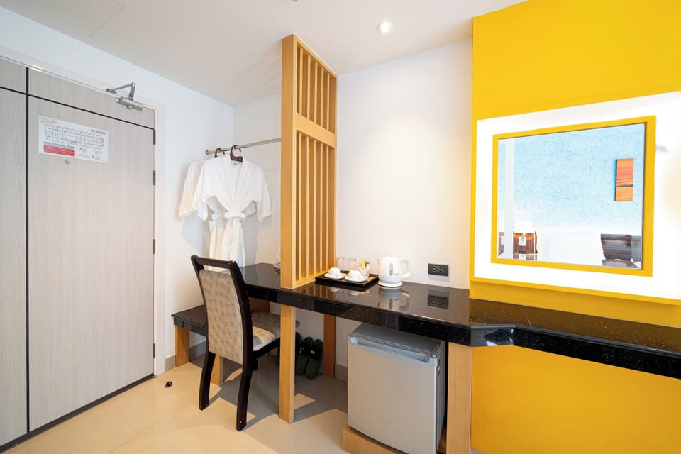 Deluxe Triple Room, City View | In-room safe, desk, laptop workspace, blackout drapes