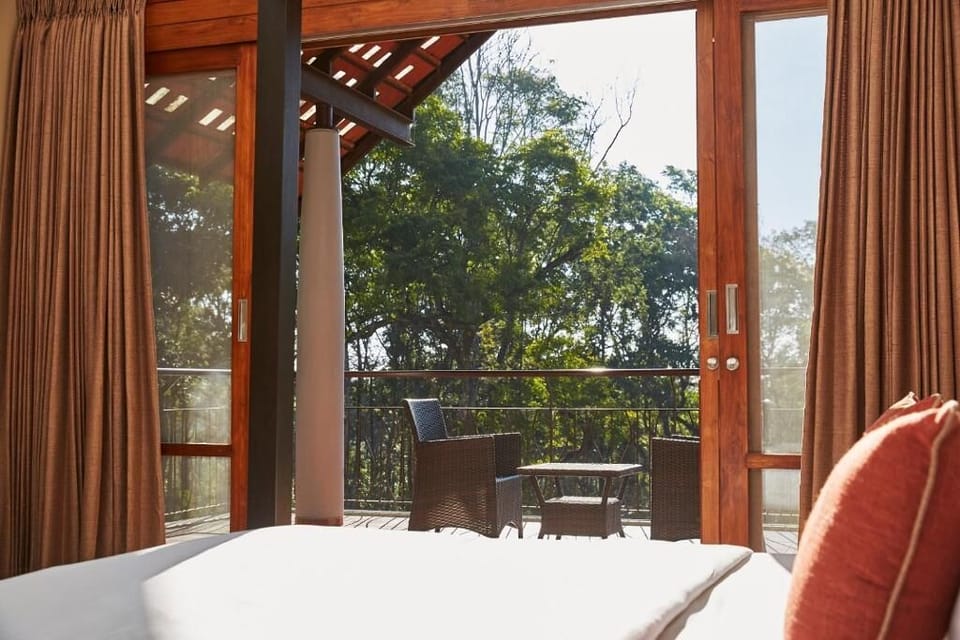 Premium Room, 1 King Bed, Balcony, Pool View | Individually decorated, individually furnished, desk, laptop workspace