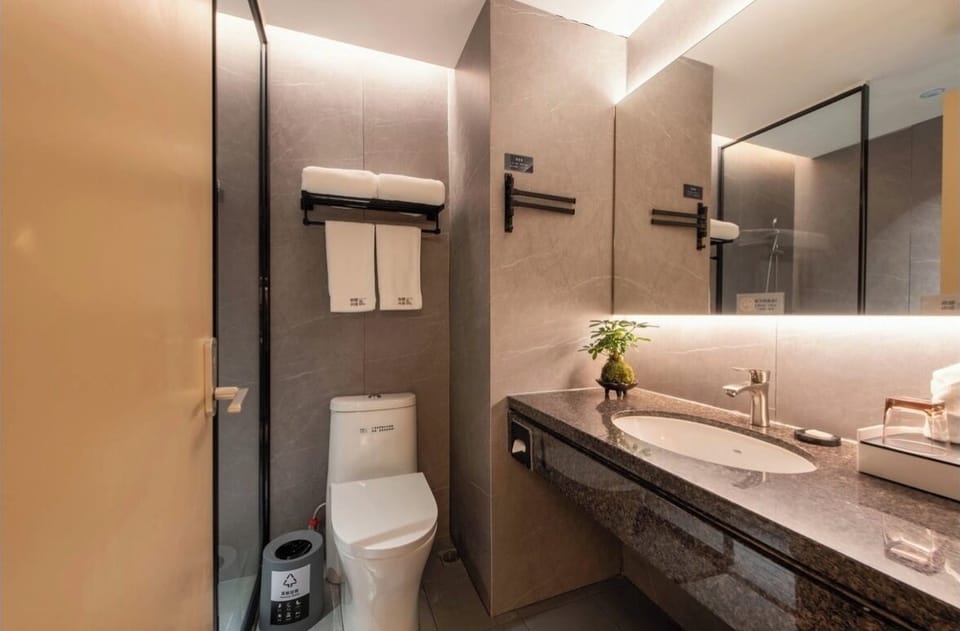Shower, free toiletries, hair dryer, slippers