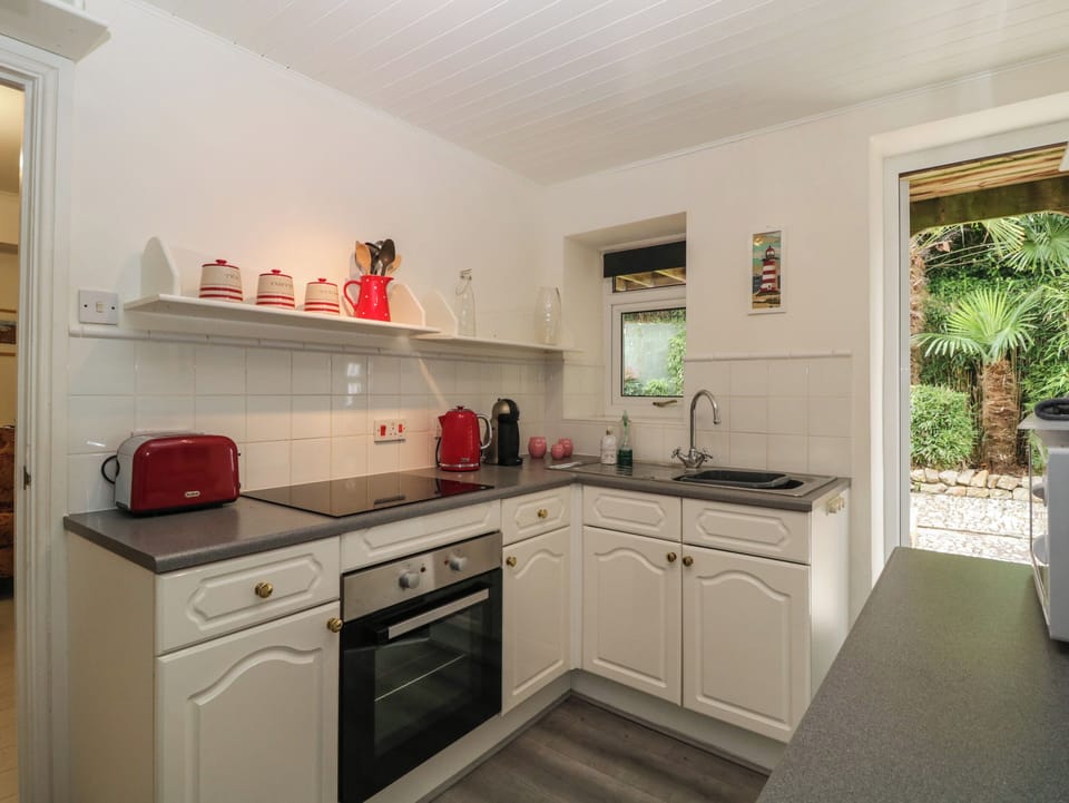 Fridge, electric kettle, cookware/dishes/utensils
