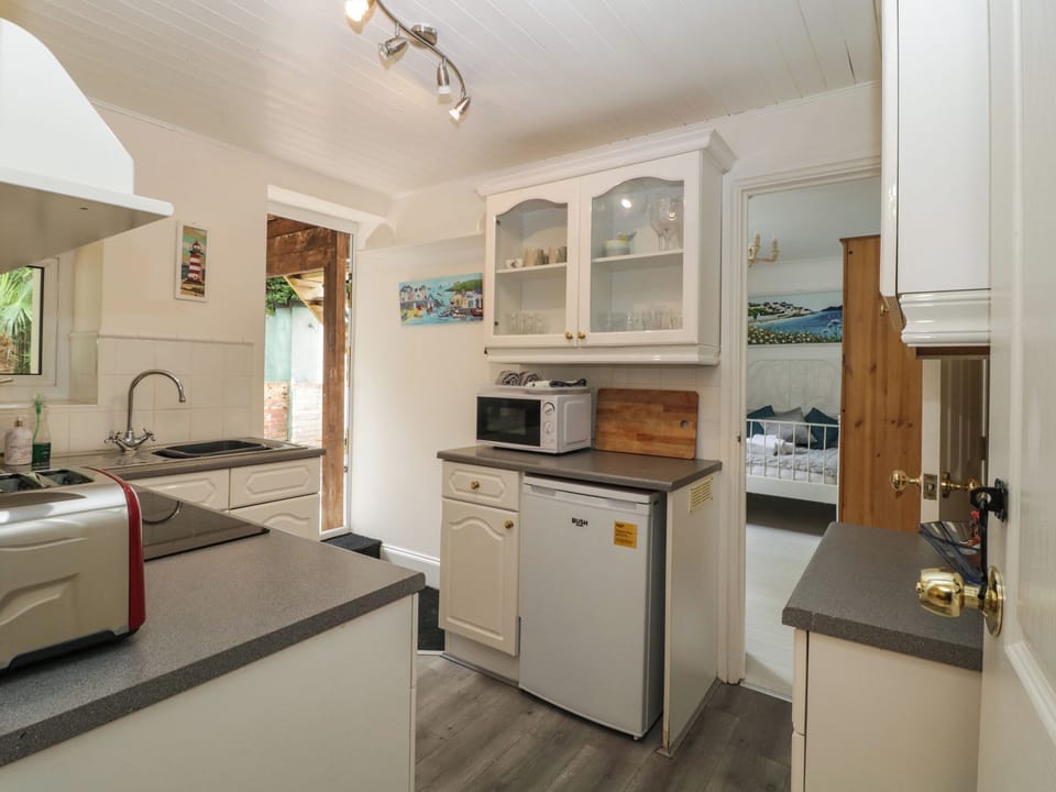 Fridge, electric kettle, cookware/dishes/utensils