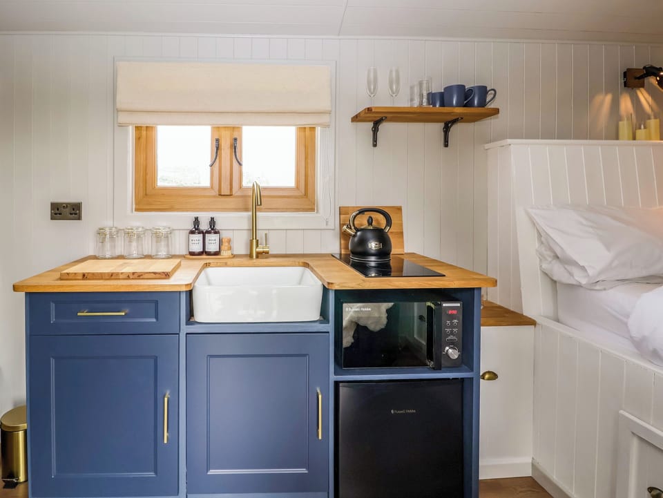 Fridge, electric kettle, toaster, cookware/dishes/utensils