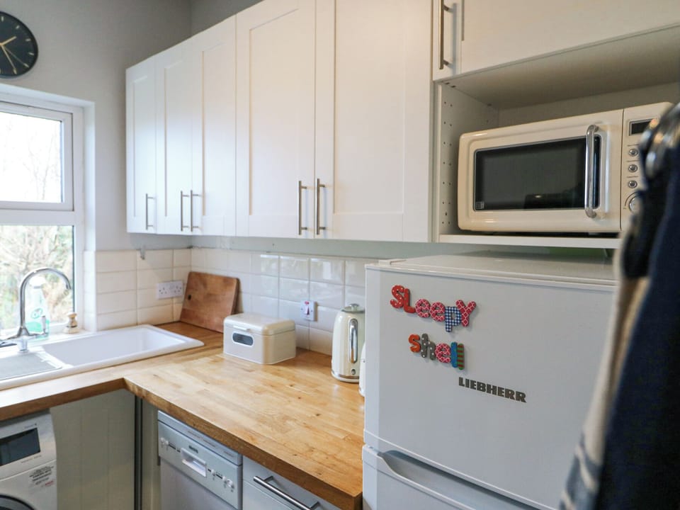 Microwave, dishwasher, toaster, cookware/dishes/utensils