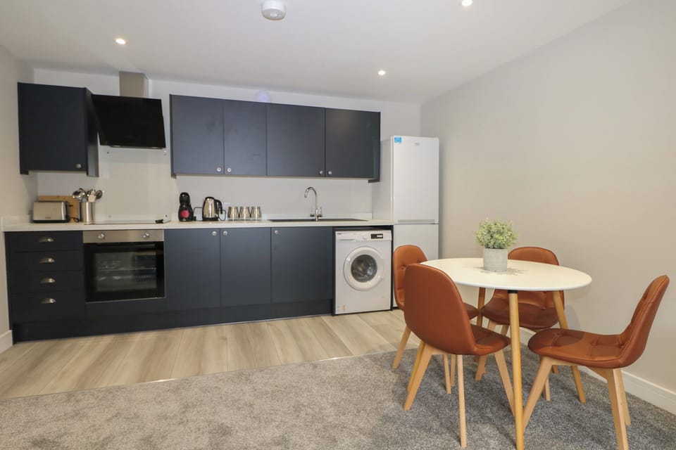 Fridge, electric kettle, cookware/dishes/utensils