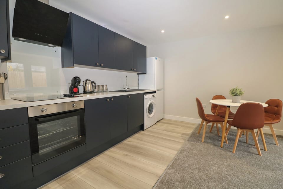 Fridge, electric kettle, cookware/dishes/utensils