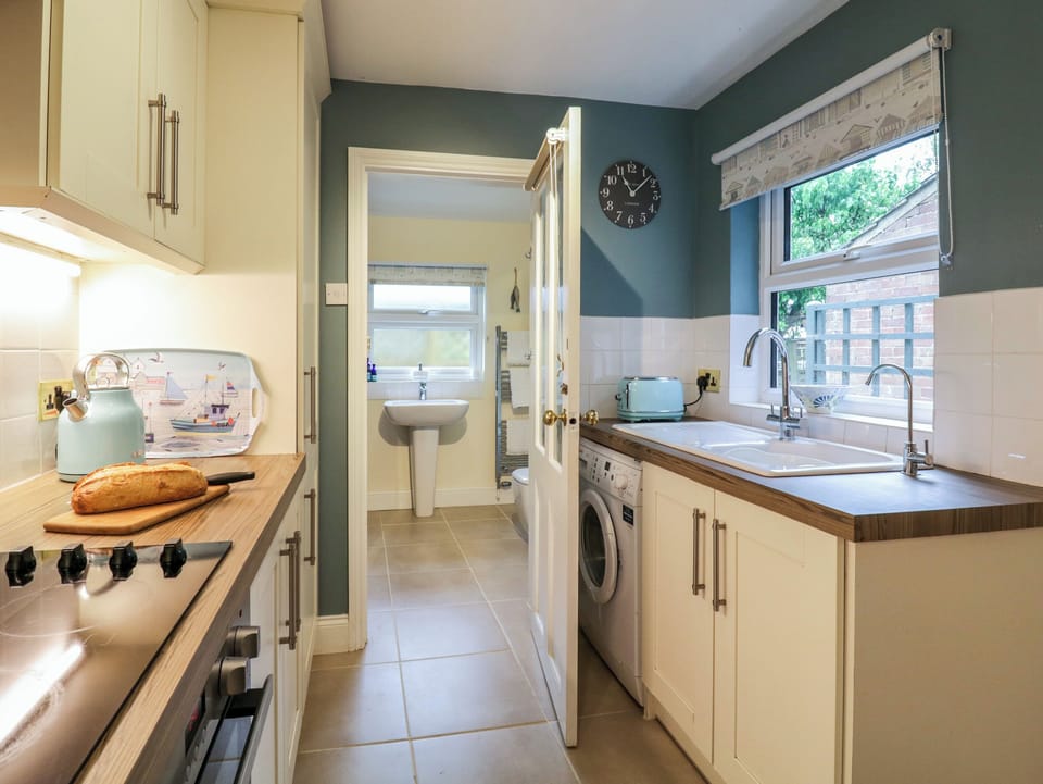 Fridge, electric kettle, toaster, cookware/dishes/utensils