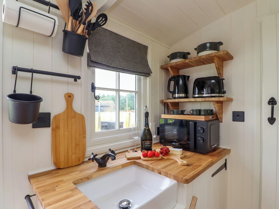 Fridge, electric kettle, toaster, cookware/dishes/utensils