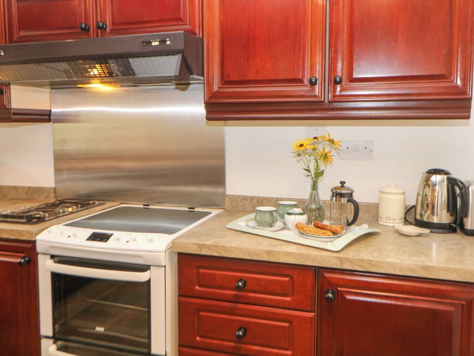Fridge, electric kettle, cookware/dishes/utensils