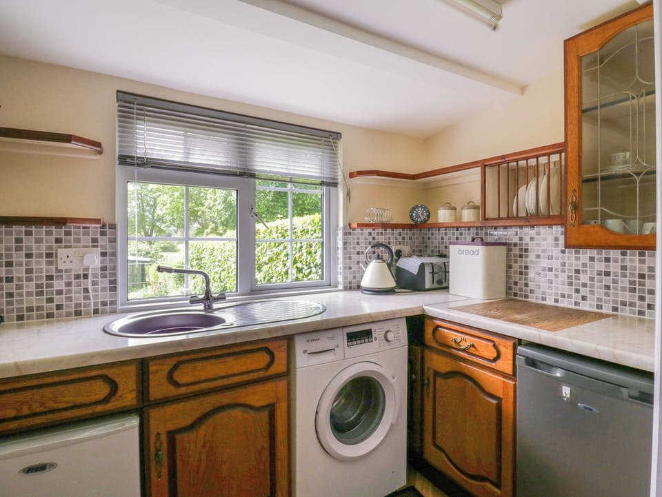 Fridge, electric kettle, toaster, cookware/dishes/utensils