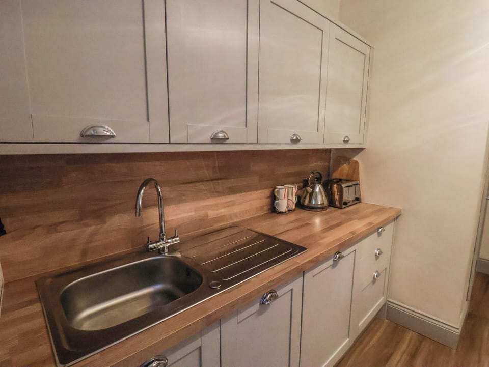 Fridge, electric kettle, toaster, cookware/dishes/utensils