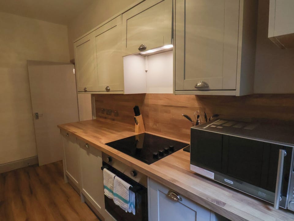 Fridge, electric kettle, toaster, cookware/dishes/utensils