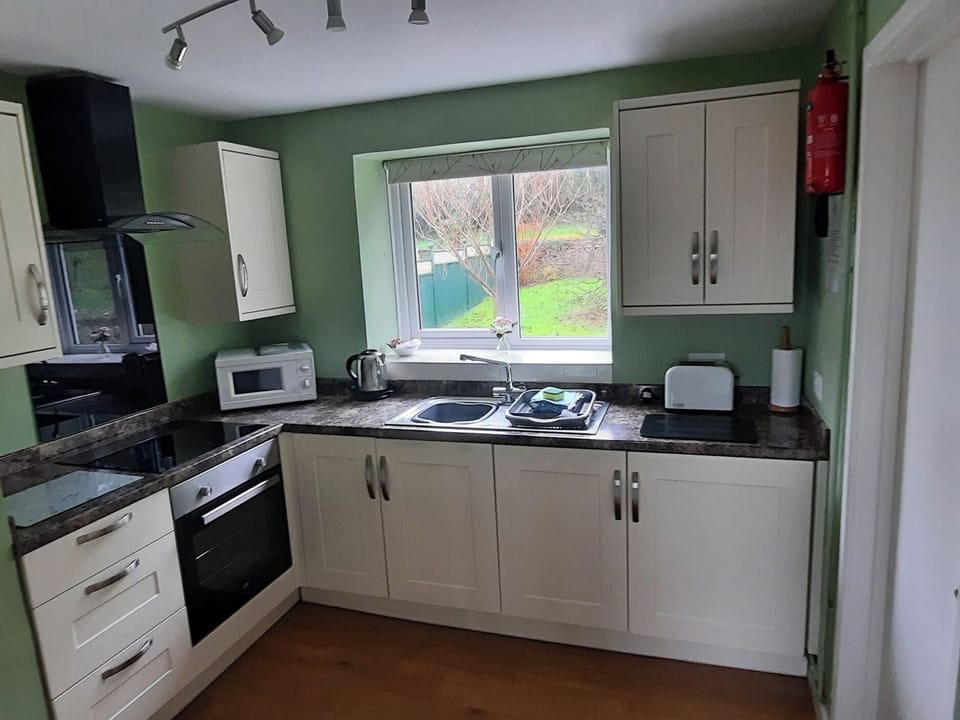 Fridge, electric kettle, cookware/dishes/utensils