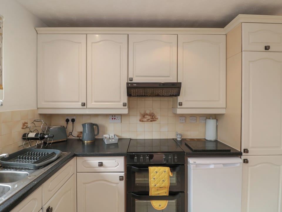 Fridge, electric kettle, toaster, cookware/dishes/utensils
