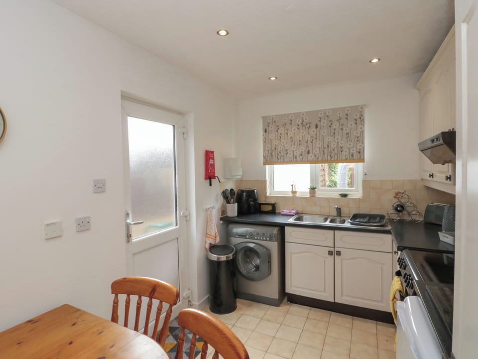 Fridge, electric kettle, toaster, cookware/dishes/utensils