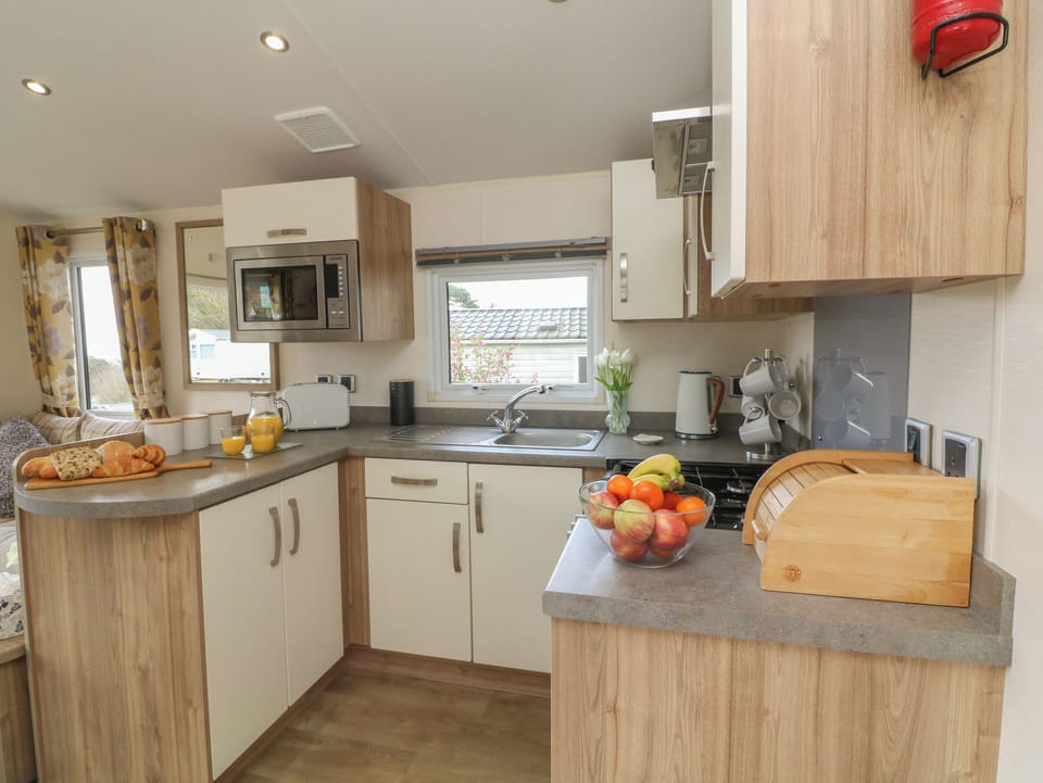 Fridge, electric kettle, toaster, cookware/dishes/utensils