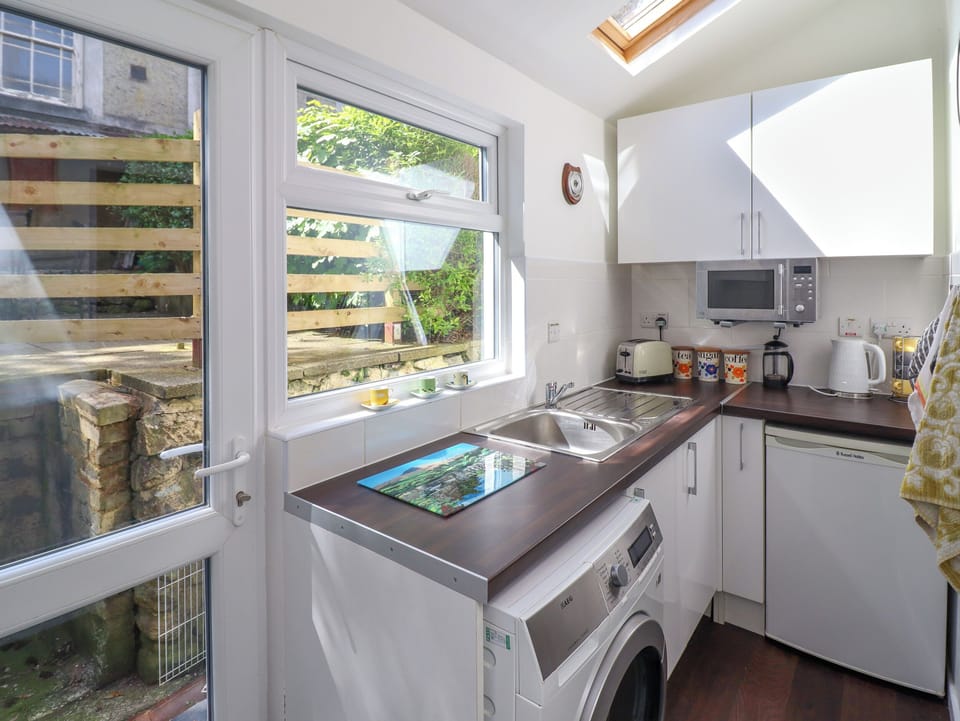 Fridge, electric kettle, toaster, cookware/dishes/utensils