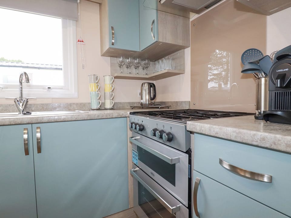 Fridge, electric kettle, toaster, cookware/dishes/utensils