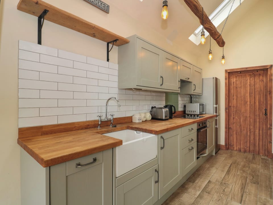 Fridge, electric kettle, toaster, cookware/dishes/utensils