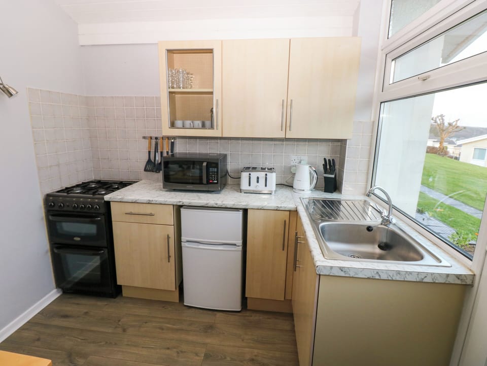 Fridge, electric kettle, toaster, cookware/dishes/utensils