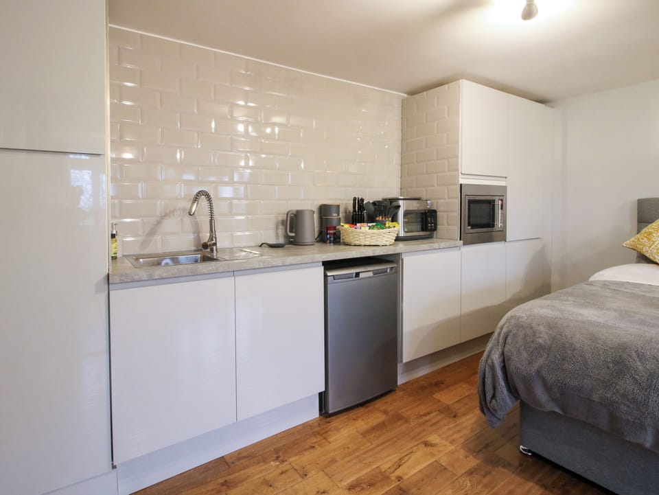 Fridge, electric kettle, cookware/dishes/utensils