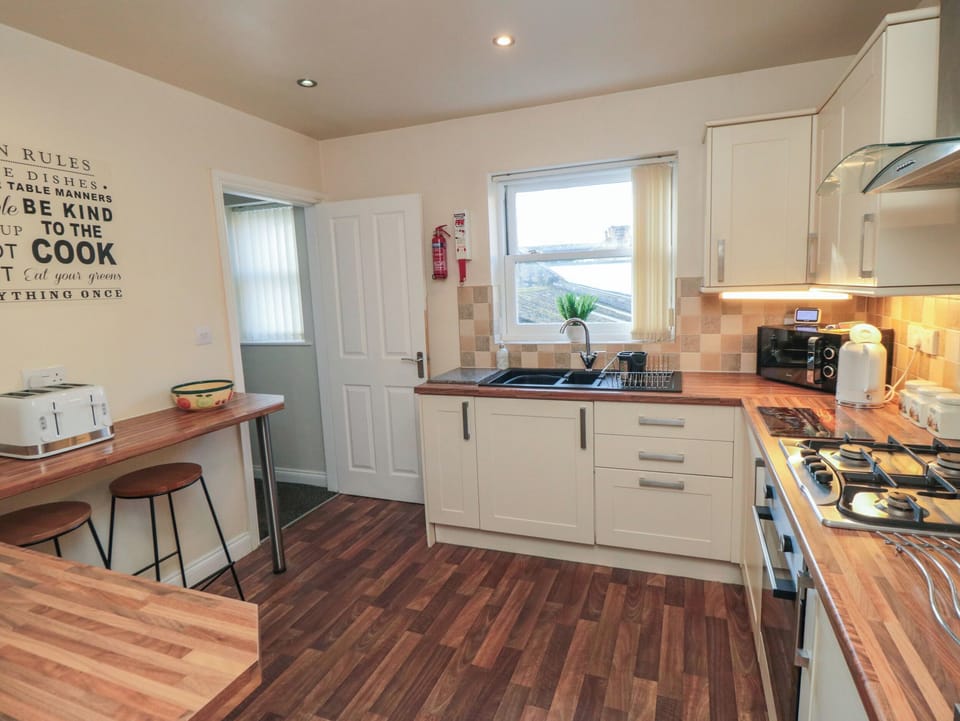 Fridge, electric kettle, cookware/dishes/utensils