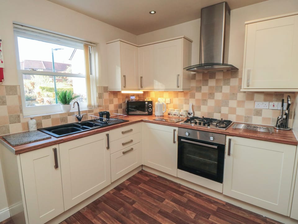 Fridge, electric kettle, cookware/dishes/utensils