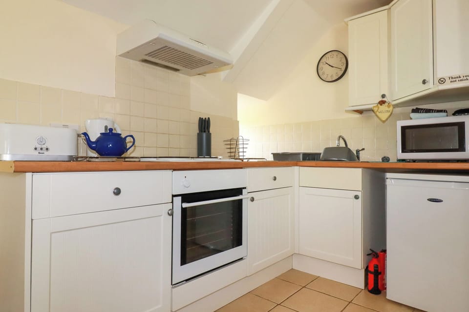 Fridge, electric kettle, toaster, cookware/dishes/utensils