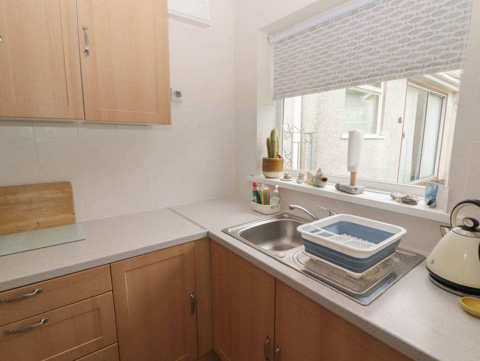 Fridge, electric kettle, toaster, cookware/dishes/utensils