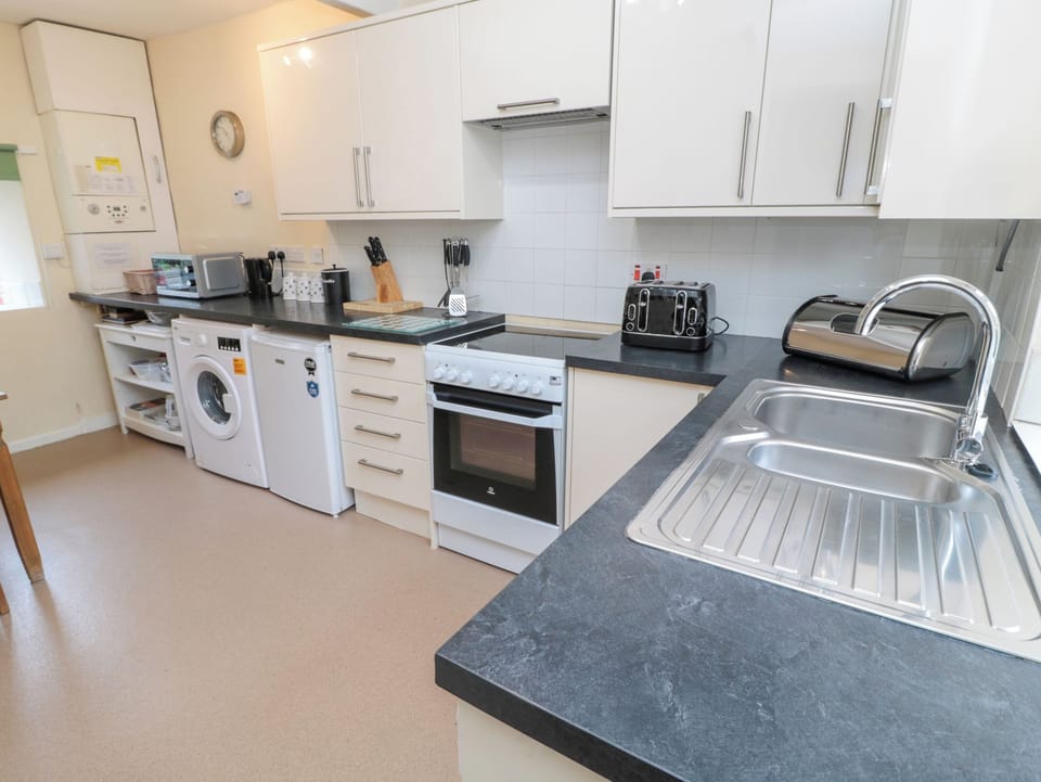 Fridge, electric kettle, toaster, cookware/dishes/utensils