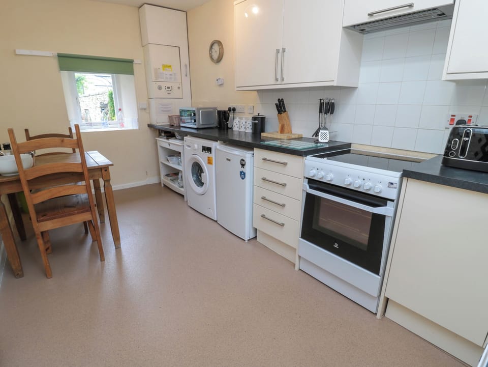 Fridge, electric kettle, toaster, cookware/dishes/utensils