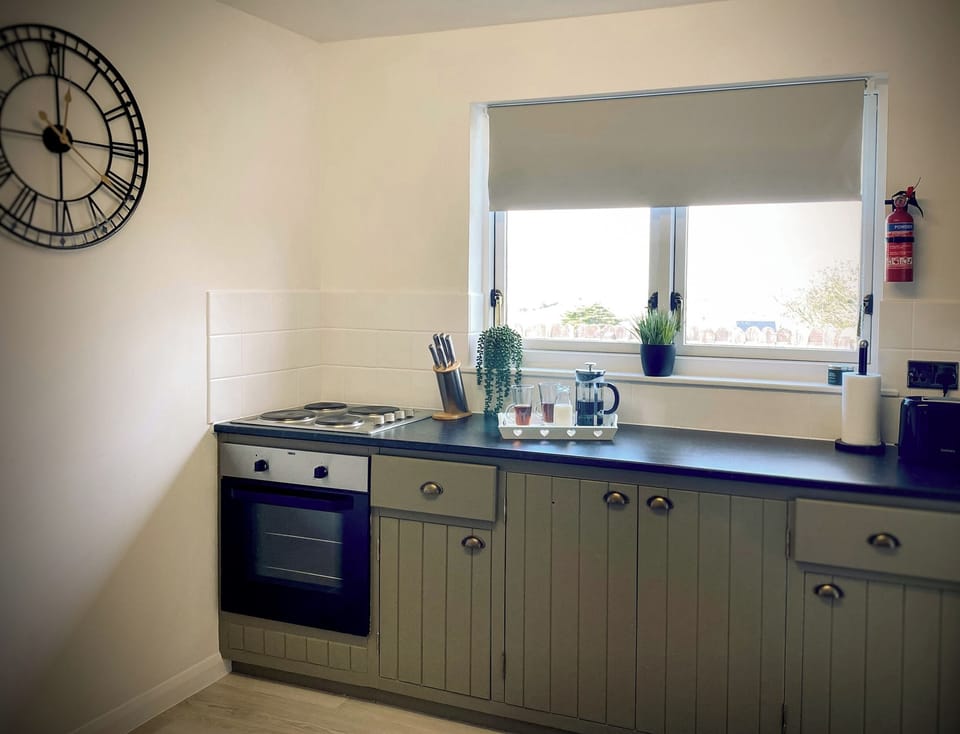 Fridge, electric kettle, cookware/dishes/utensils
