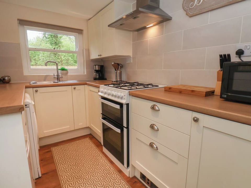 Fridge, electric kettle, toaster, cookware/dishes/utensils