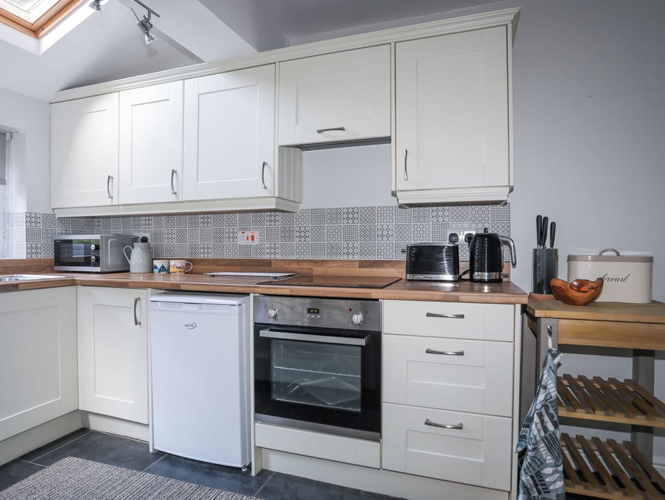 Fridge, electric kettle, toaster, cookware/dishes/utensils