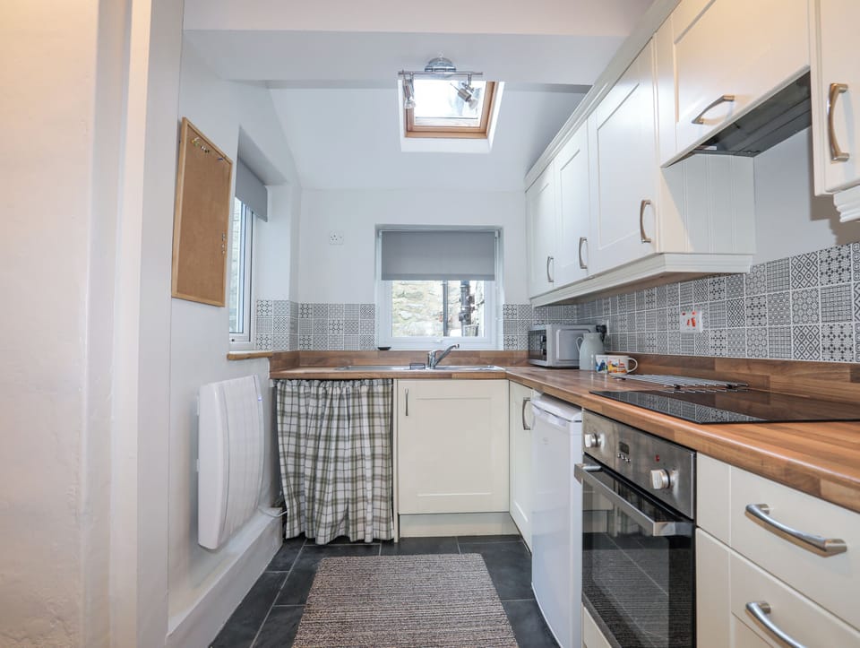 Fridge, electric kettle, toaster, cookware/dishes/utensils