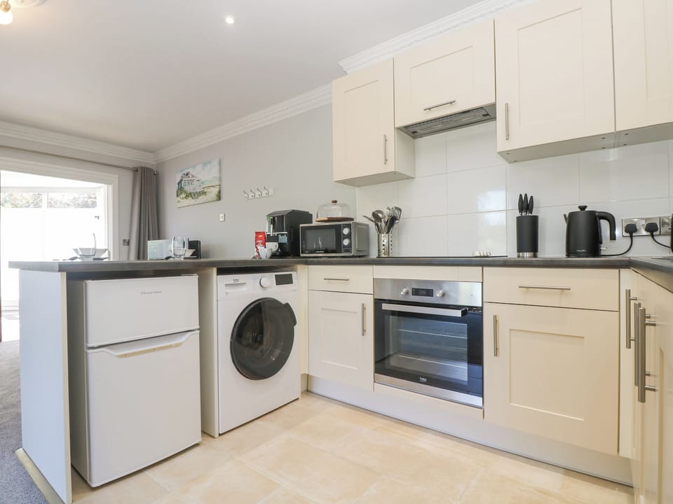 Fridge, electric kettle, toaster, cookware/dishes/utensils