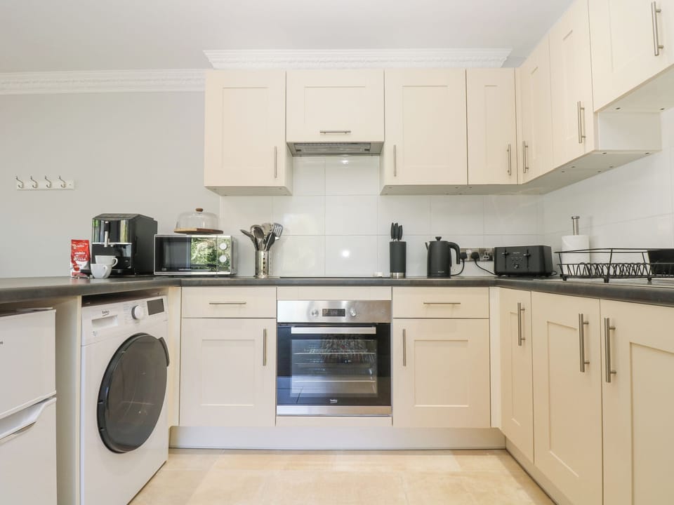 Fridge, electric kettle, toaster, cookware/dishes/utensils