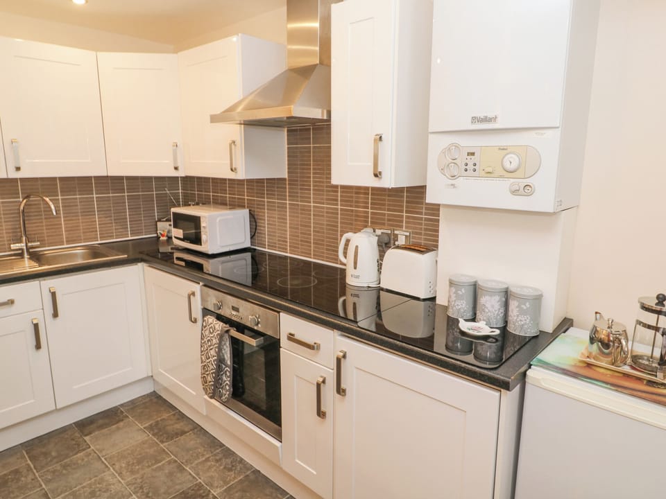 Fridge, electric kettle, toaster, cookware/dishes/utensils