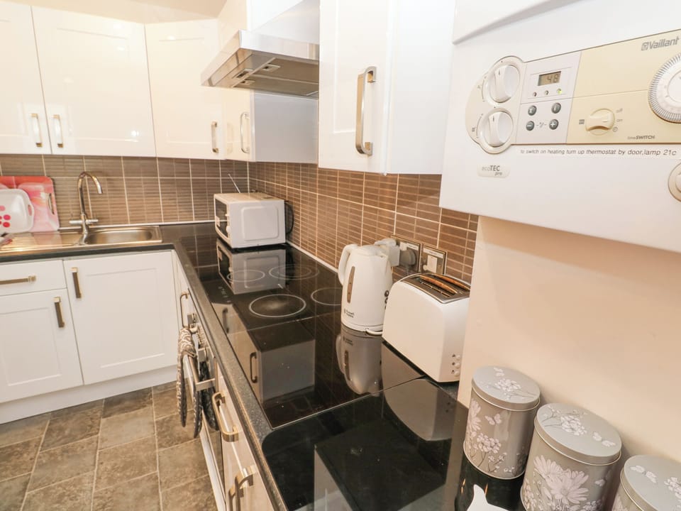Fridge, electric kettle, toaster, cookware/dishes/utensils