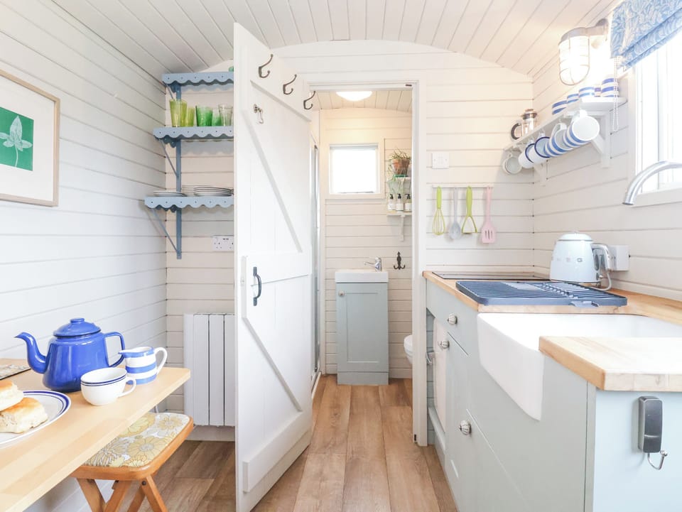Fridge, electric kettle, cookware/dishes/utensils