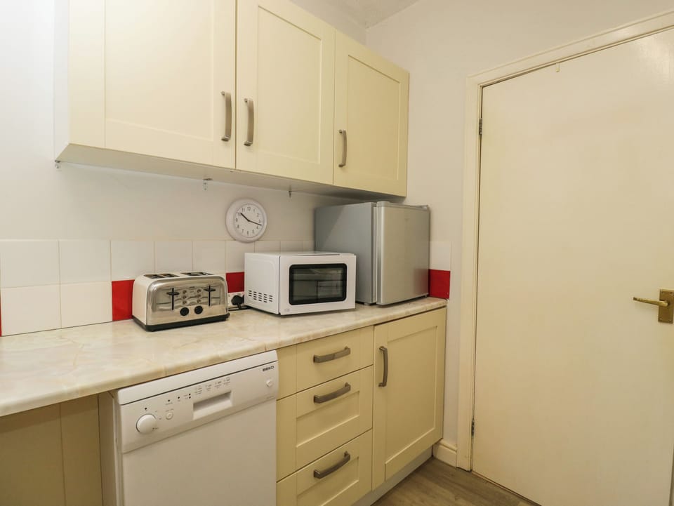 Fridge, dishwasher, electric kettle, cookware/dishes/utensils