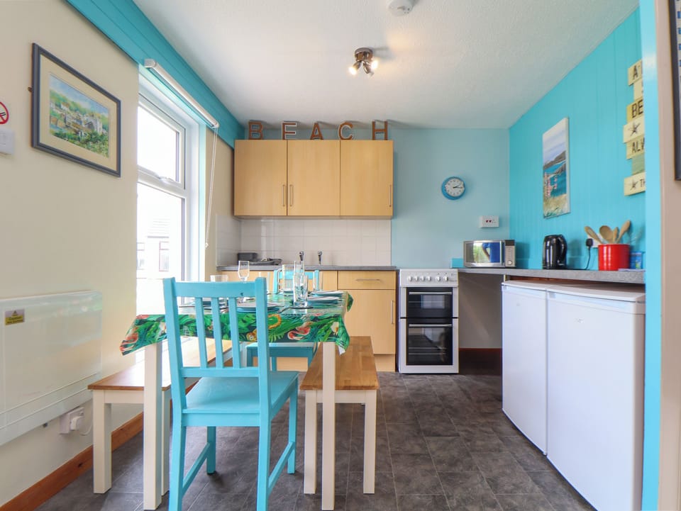 Fridge, electric kettle, cookware/dishes/utensils
