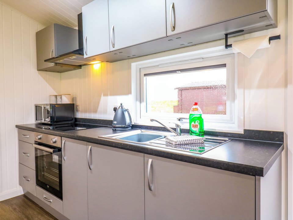 Fridge, electric kettle, cookware/dishes/utensils