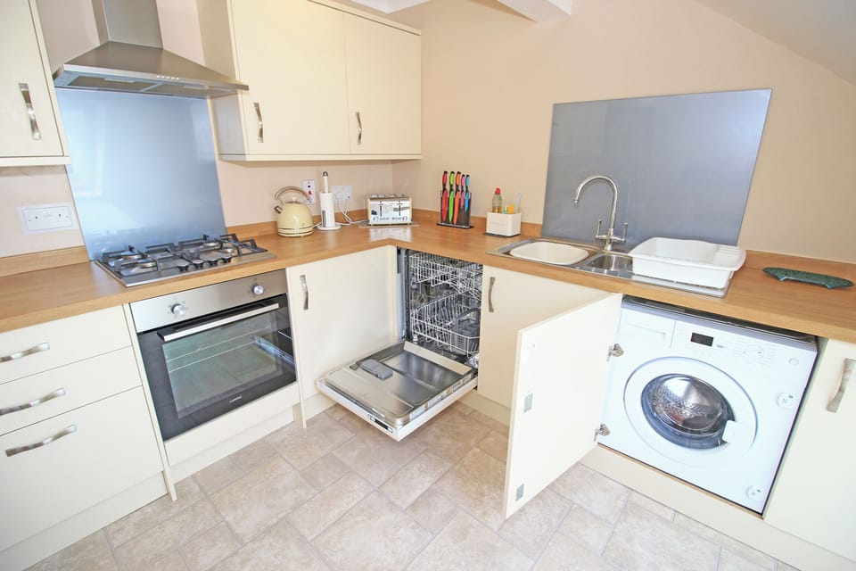 Fridge, dishwasher, electric kettle, cookware/dishes/utensils