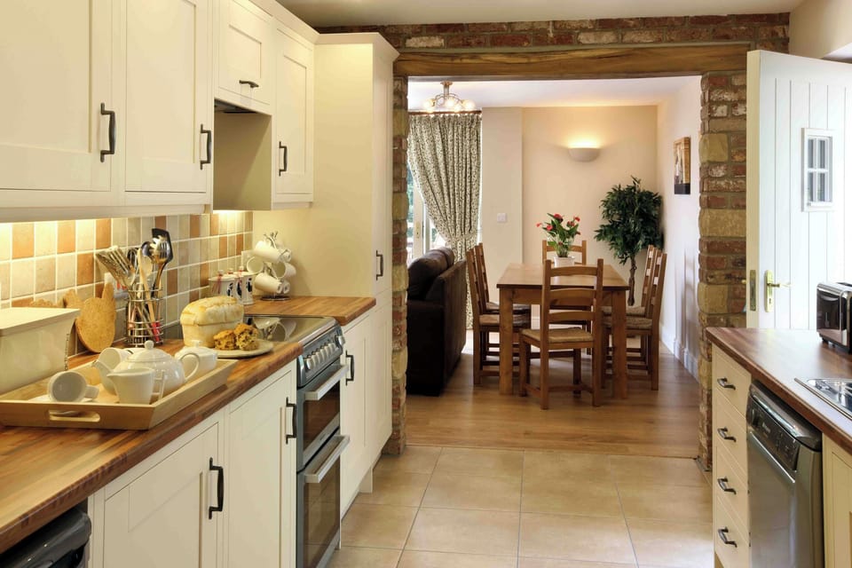 Fridge, electric kettle, toaster, cookware/dishes/utensils