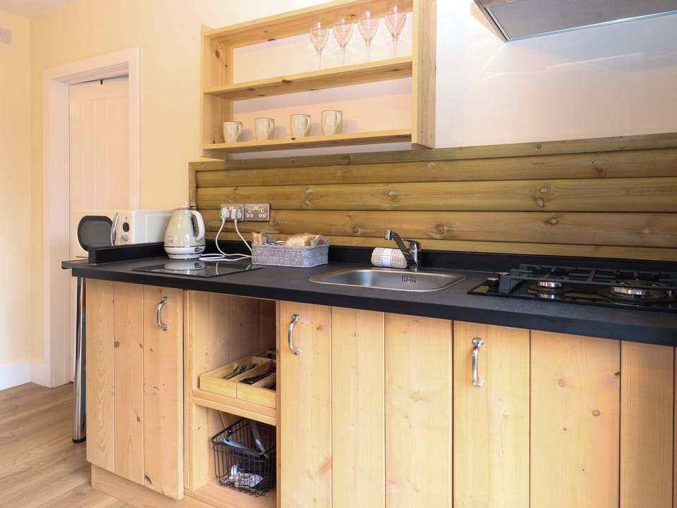 Fridge, electric kettle, cookware/dishes/utensils
