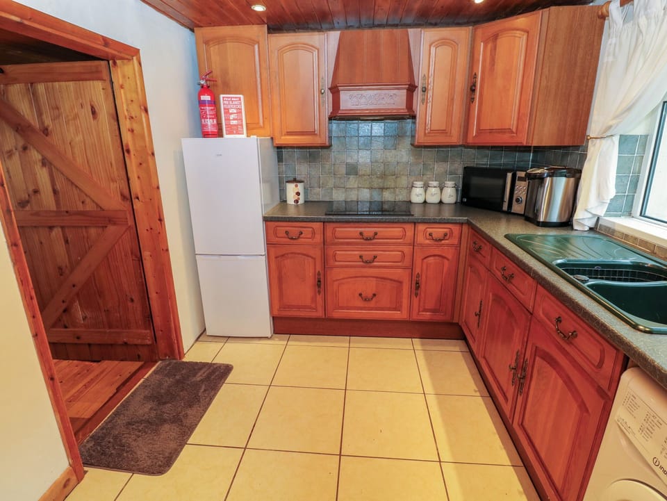 Fridge, electric kettle, cookware/dishes/utensils