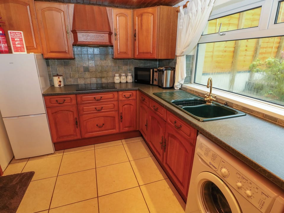 Fridge, electric kettle, cookware/dishes/utensils