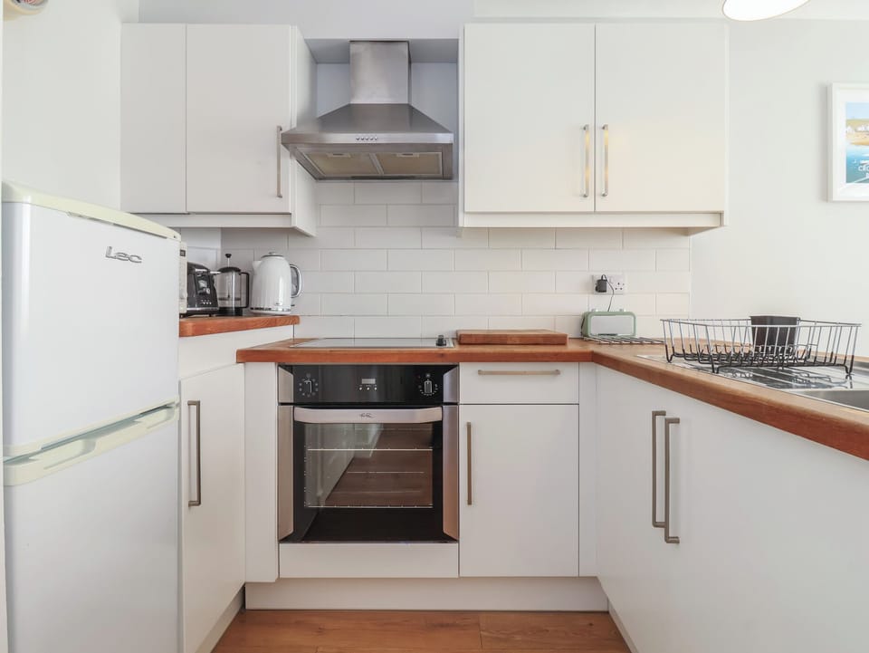 Fridge, electric kettle, toaster, cookware/dishes/utensils